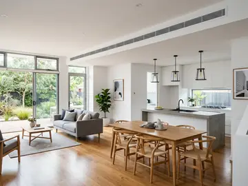 Linear slot ducted air conditioning vents in a living room ceiling